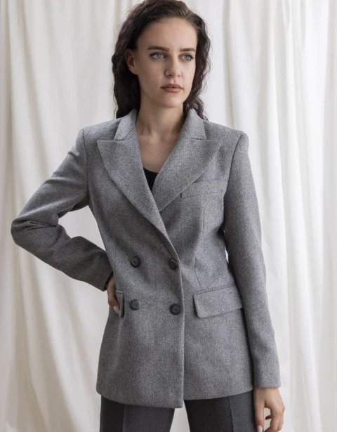 Model in a grey double-breasted blazer