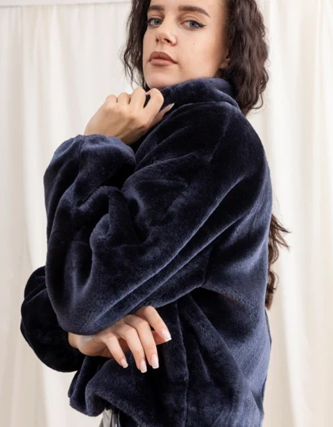 Model in a navy faux fur coat